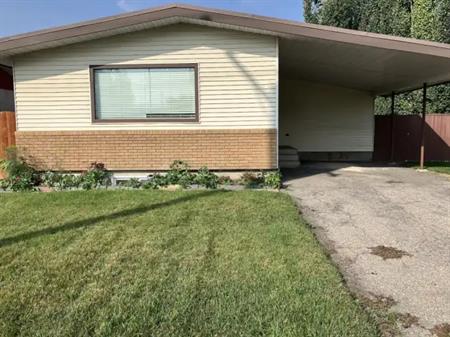 3 bedroom main floor with a large fenced  yard large deck carport parking | 447 Acadia Drive Southeast, Calgary