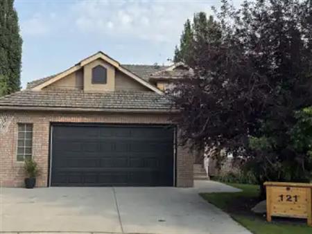 Evergreen Estates Walkout Bungalow Backing onto Green Belt | Calgary
