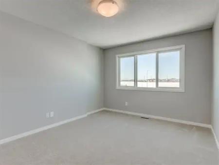 Front-drive home with 4 Bed +Deck + AC + Finished Basement | Calgary