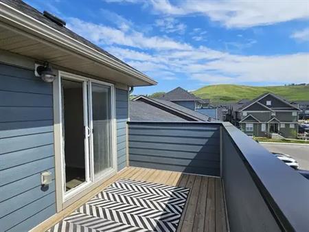 2 Parking Stalls with 2 Bedroom + Den, Rooftop Patio and Fenced Backyard | Calgary