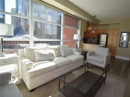 Pristine views and sunshine in thStylish Executive Furnished Suite in Eau Claire | 205 Riverfront Avenue Southwest, Calgary