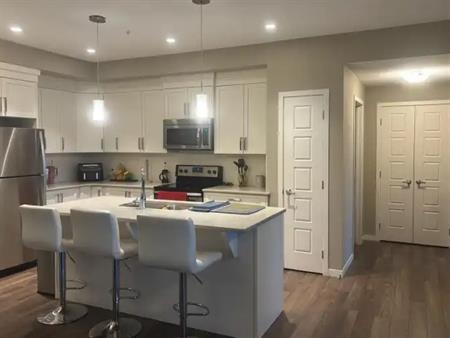 2 Bed + Den/Studio | 2 Bath | 1,158 sq ft | New Brighton SE | Underground Parkin | 209 - 6703 New Brighton Avenue Southeast, 