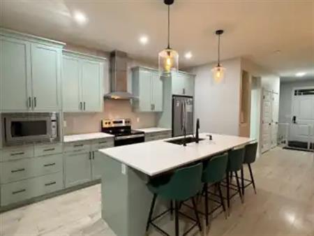 3.5 Beds 2.5 Baths - House (Extended garage+EV Charging) Main floor only. | 44 Edith Mews Northwest, Calgary