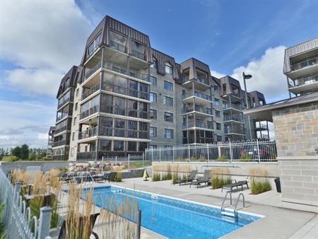 Condo Vue sur le Golf de la Faune / stationnement intérieur